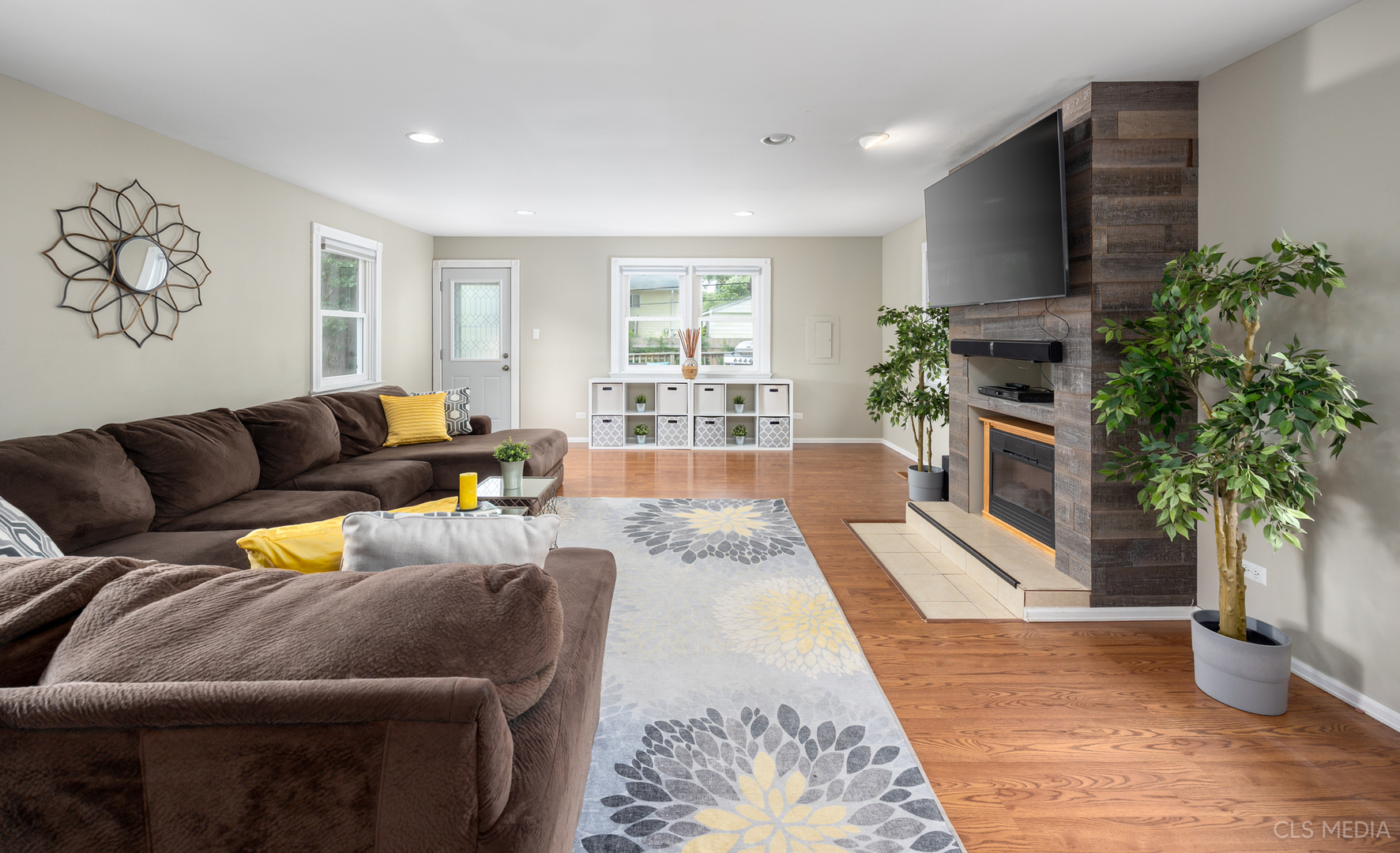110 Cedar Circle Streamwood, IL 60107 - Photo 9 of 28 a living room with furniture fireplace and potted plants