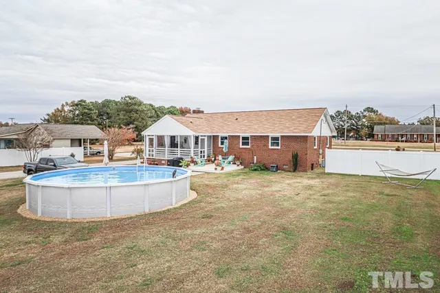 a kitchen with white cabinets stainless steel appliances and sink