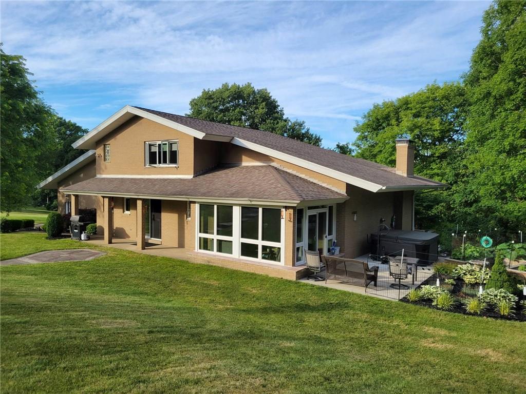1855 Alamae Lakes Road Washington, PA 15301 - Photo 2 of 21 a front view of a house with a garden