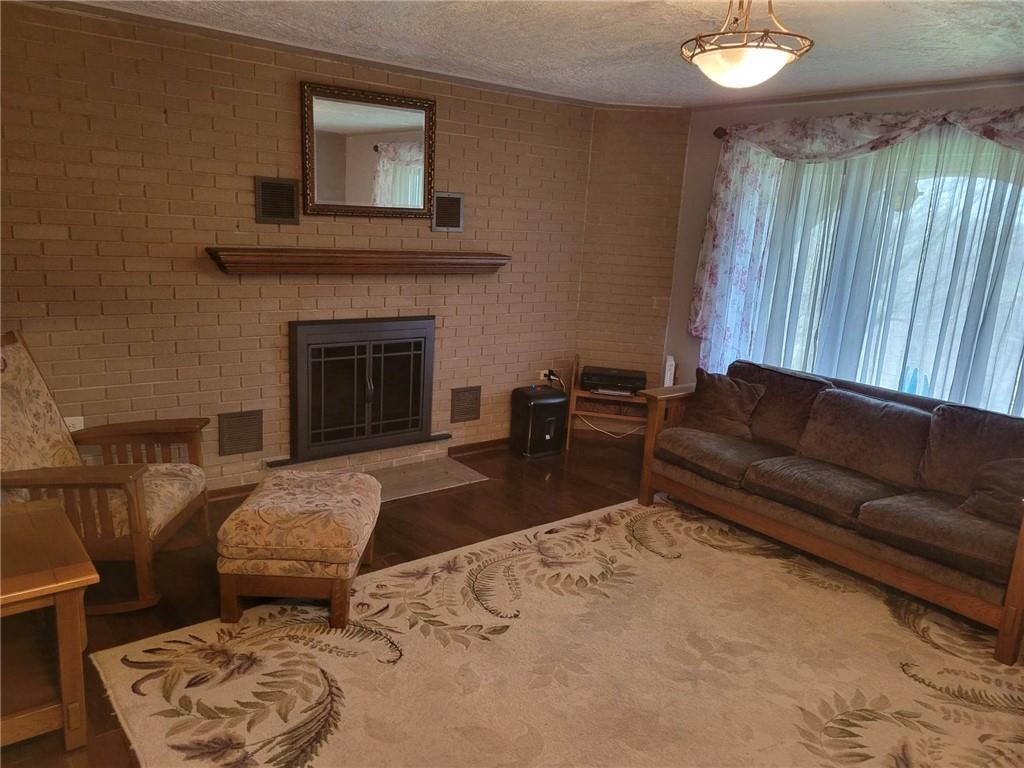 1855 Alamae Lakes Road Washington, PA 15301 - Photo 7 of 21 a living room with furniture and a fireplace
