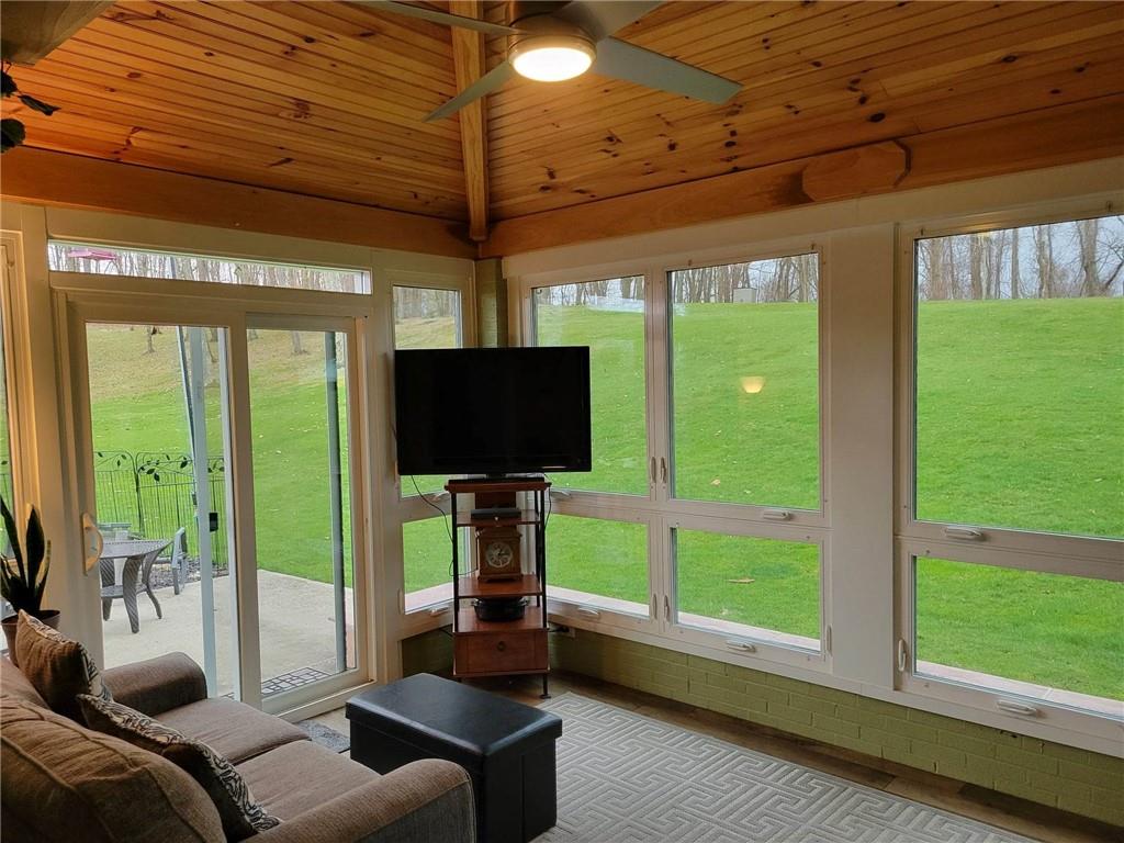 1855 Alamae Lakes Road Washington, PA 15301 - Photo 8 of 21 a living room with furniture tv and a large window