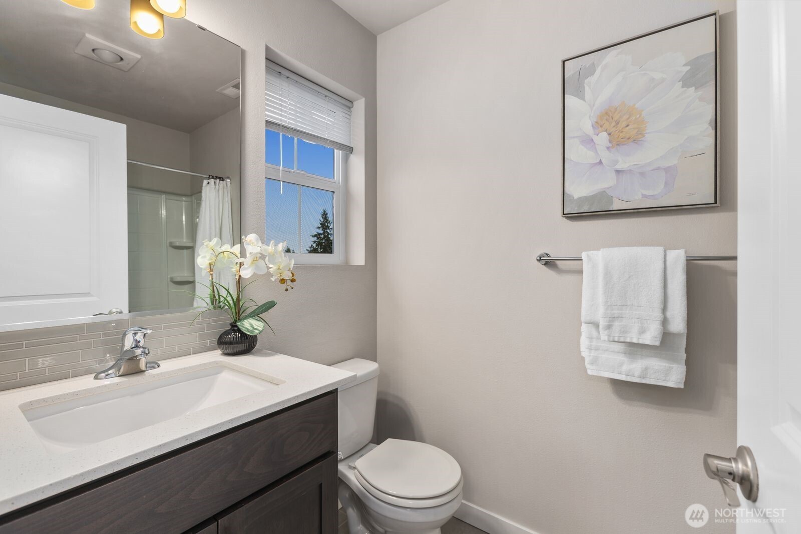 1621 Seattle Hill Road, Unit C4 Bothell, WA 98012 - Photo 23 of 35 a bathroom with a toilet a sink and mirror
