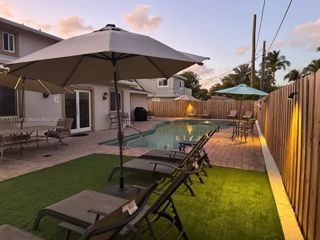 a view of a swimming pool with a patio