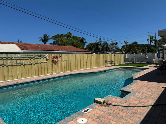 a view of swimming pool with a yard