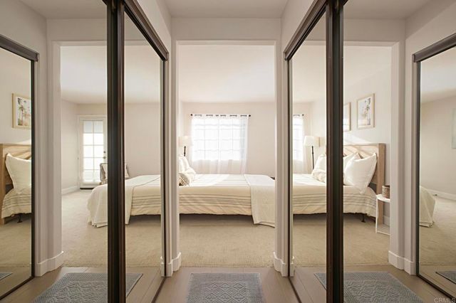 a en suite bathroom with a glass shower door and a mirror