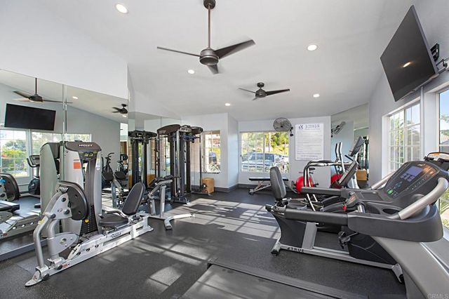a view of a swimming pool with chairs in patio