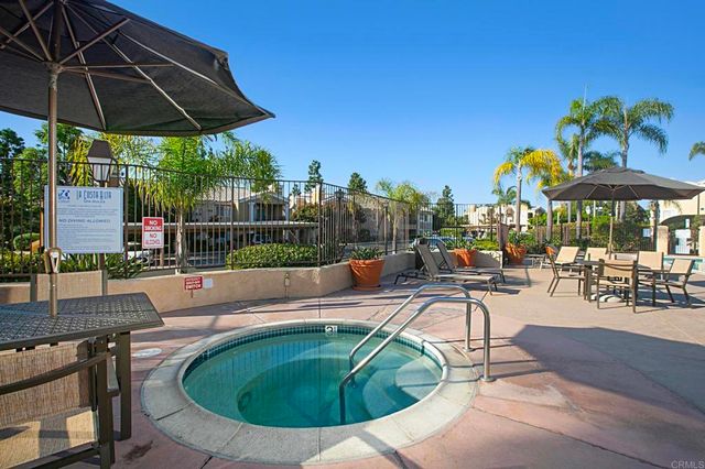 a view of a swimming pool with chairs