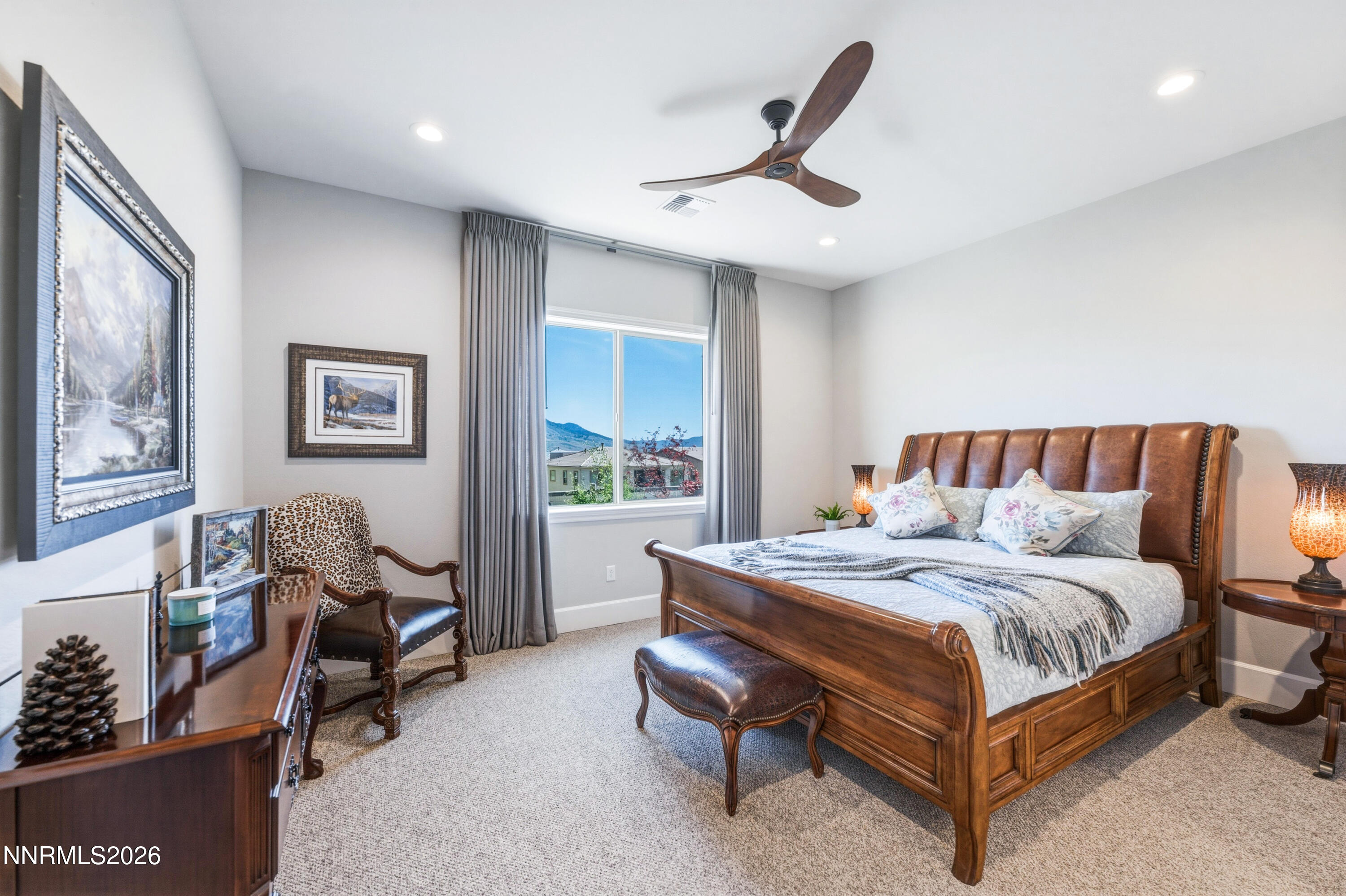 9028 Iron Sky Court Reno, NV 89523 - Photo 23 of 36 a bedroom with a bed and wooden floor
