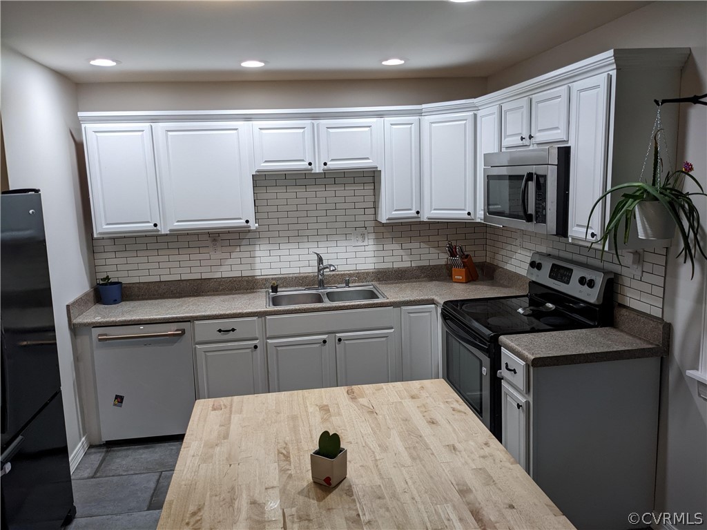 423 Deter Road Richmond, VA 23225 - Photo 3 of 18 Cafe Dishwasher and Garbage disposal. Butcher block island and storage