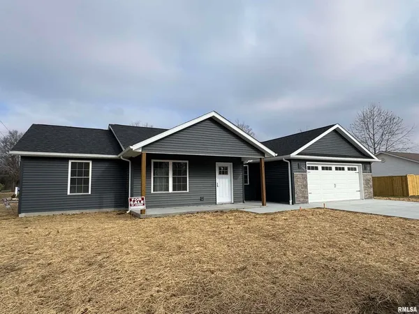 a front view of a house with yard