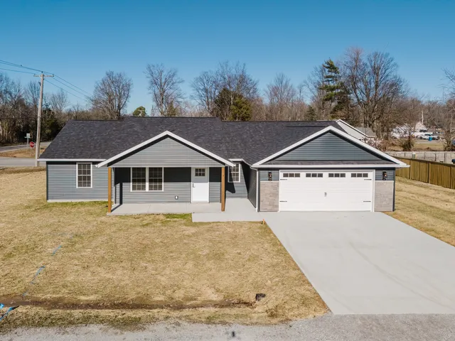 a house with trees in the background