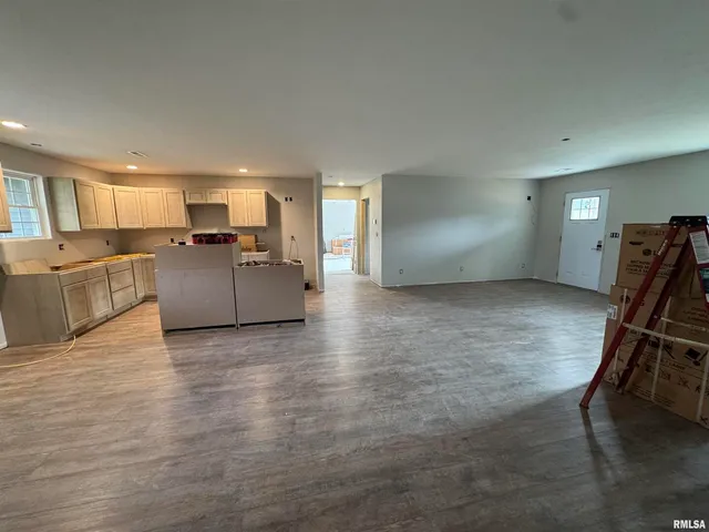 a view of a kitchen with furniture and a window