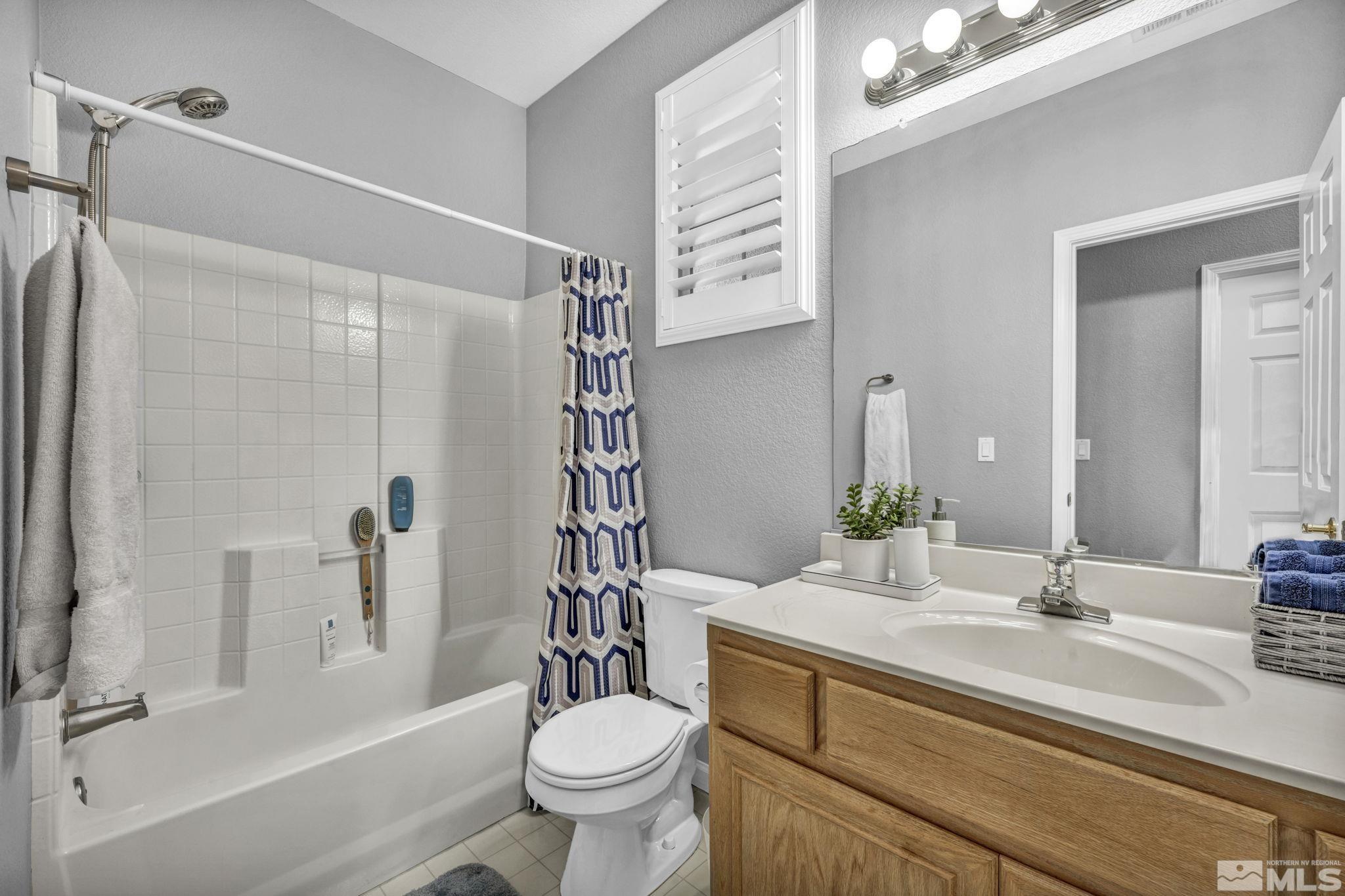 10518 French Meadows Way Reno, NV 89521 - Photo 17 of 34 a bathroom with a sink toilet and shower