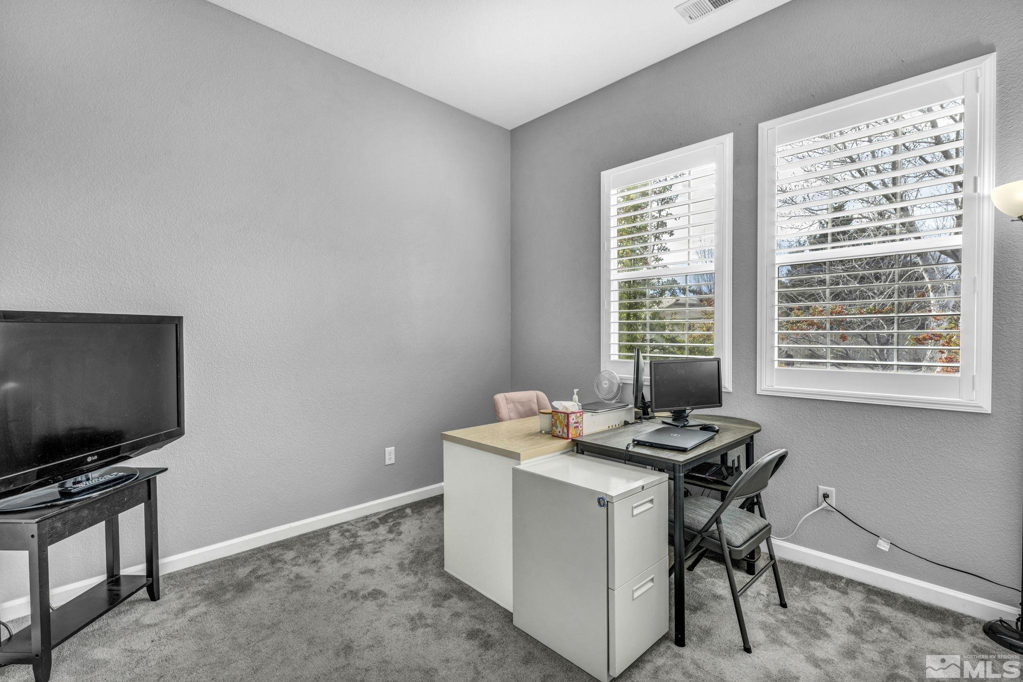 10518 French Meadows Way Reno, NV 89521 - Photo 19 of 34 a view of a workspace with furniture and a window