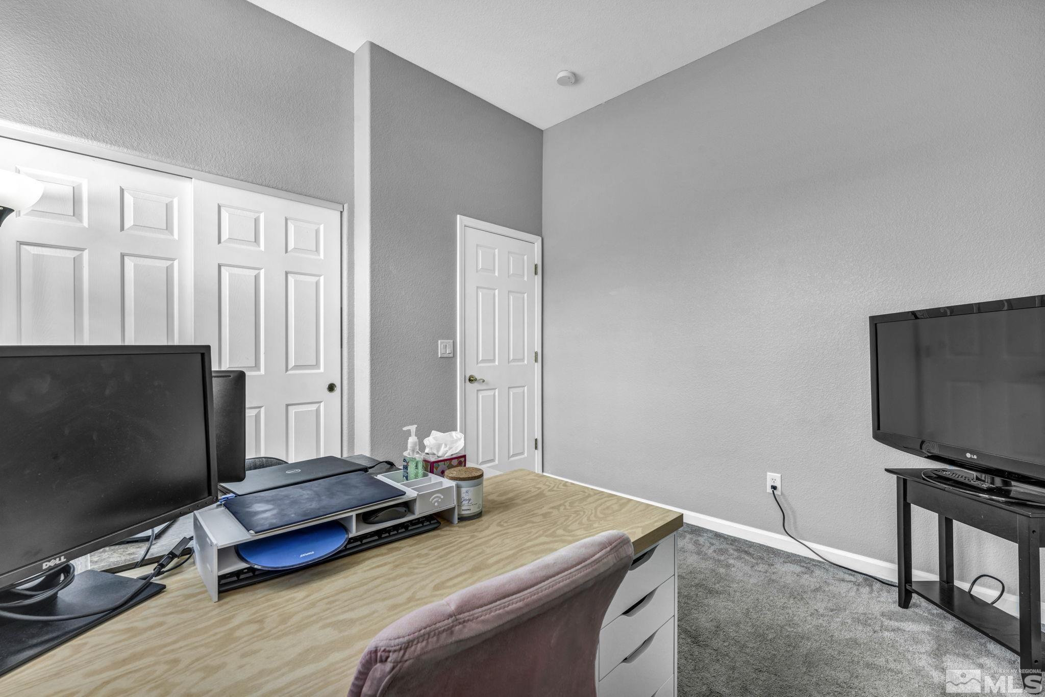 10518 French Meadows Way Reno, NV 89521 - Photo 20 of 34 a living room with furniture and a flat screen tv