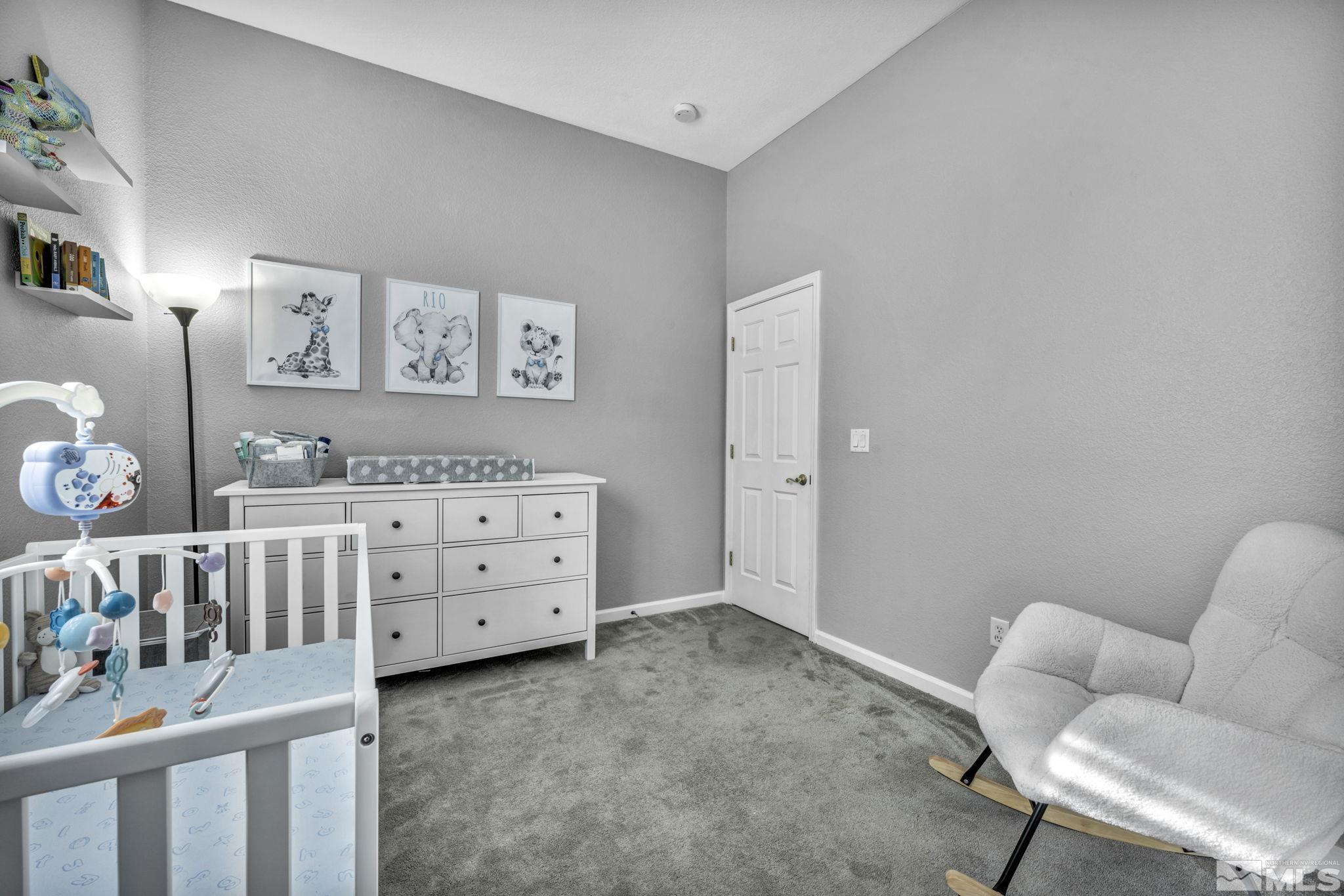 10518 French Meadows Way Reno, NV 89521 - Photo 22 of 34 a bedroom with furniture and a wooden floor
