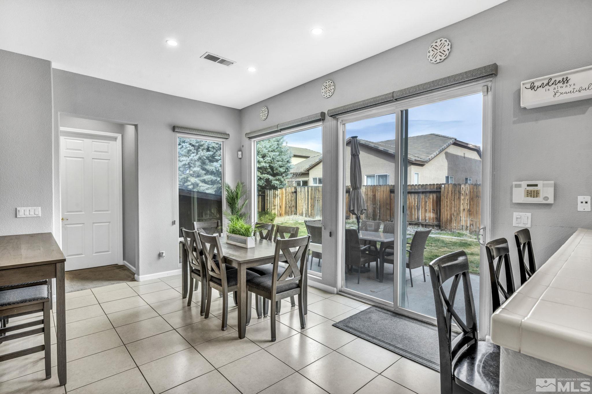 10518 French Meadows Way Reno, NV 89521 - Photo 27 of 34 a view of a dining room with furniture window and outside view