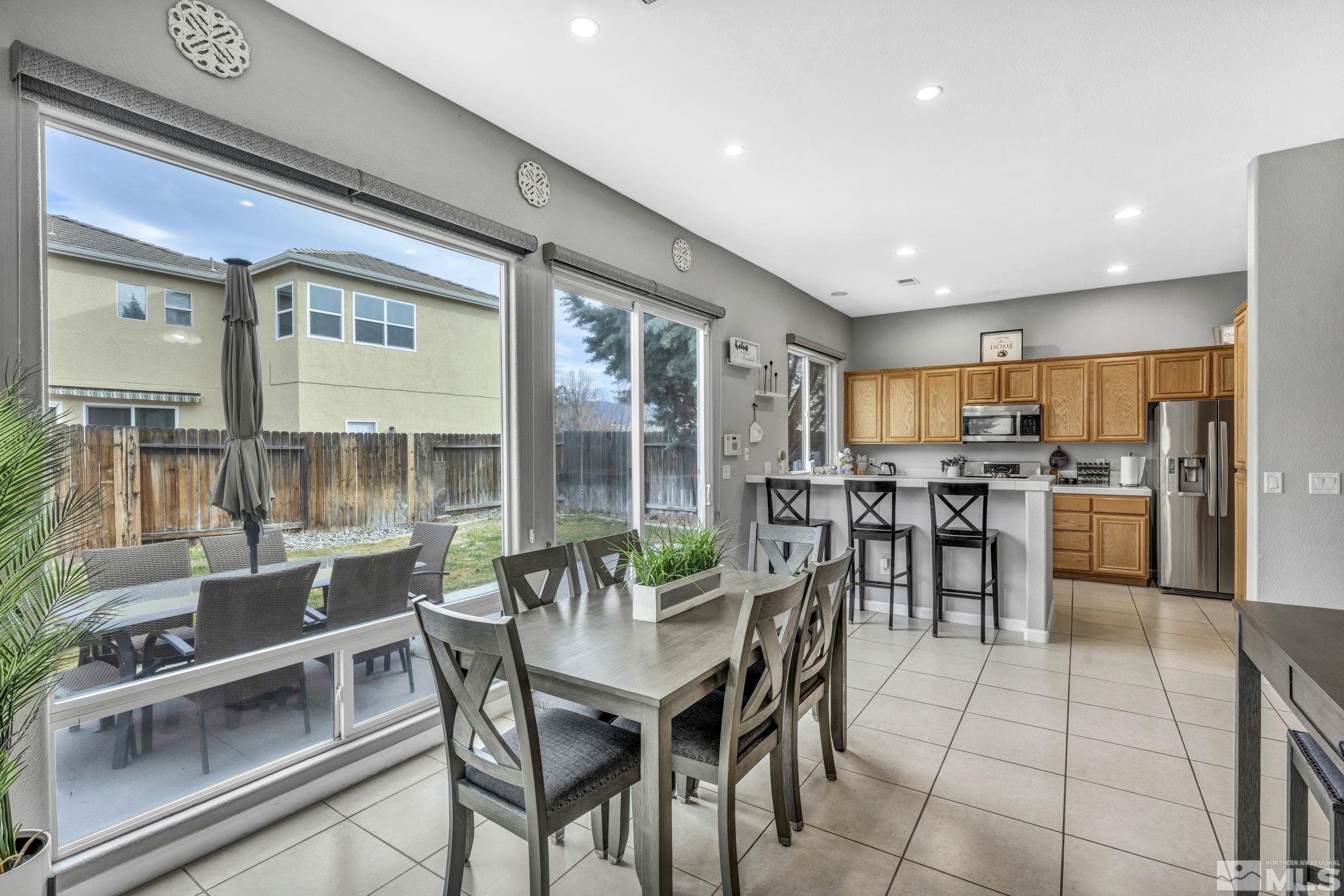 10518 French Meadows Way Reno, NV 89521 - Photo 29 of 34 a view of a dining room with furniture window and outside view