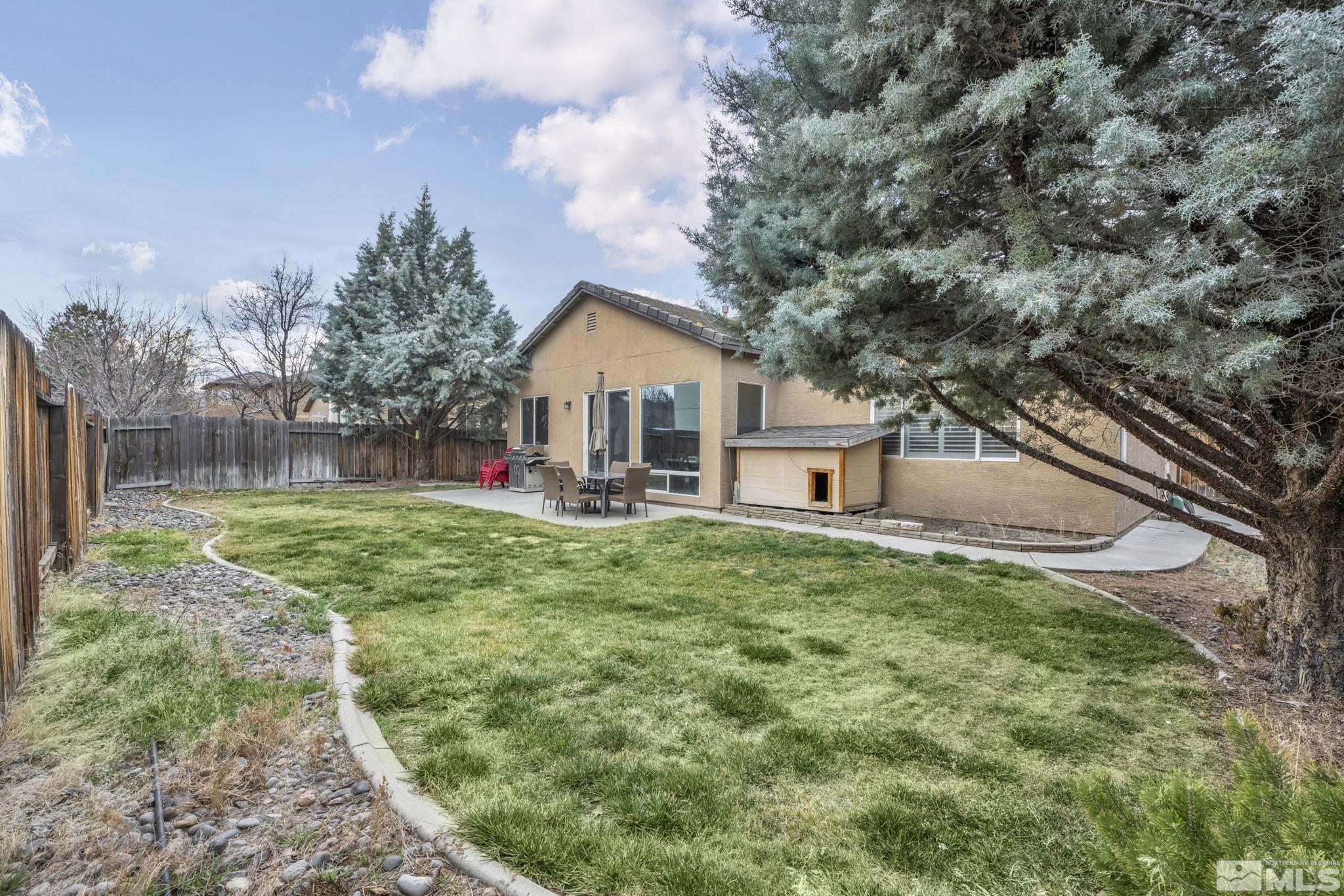 10518 French Meadows Way Reno, NV 89521 - Photo 3 of 34 a view of a house with backyard and a tree