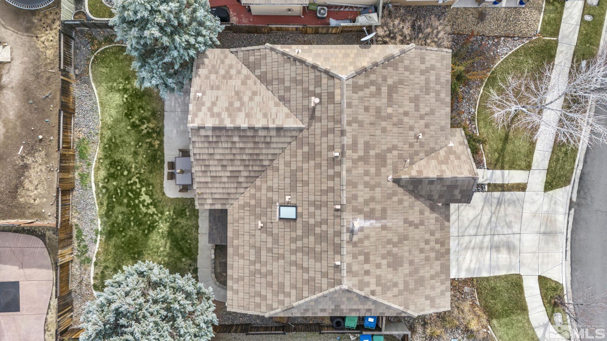 10518 French Meadows Way Reno, NV 89521 - Photo 8 of 34 an aerial view of a house with a yard and large trees