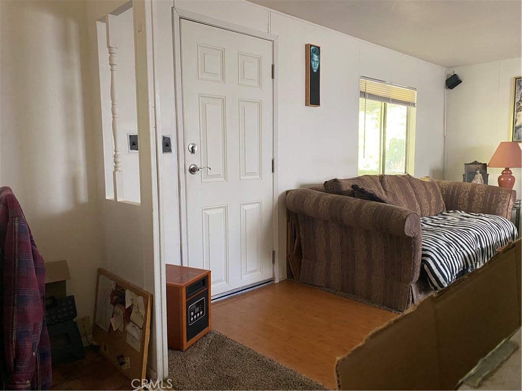 7360 Lassen Street Nice, CA 95464 - Photo 5 of 13 a living room with a bed and a window
