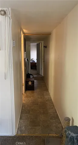 a view of a bedroom from a hallway