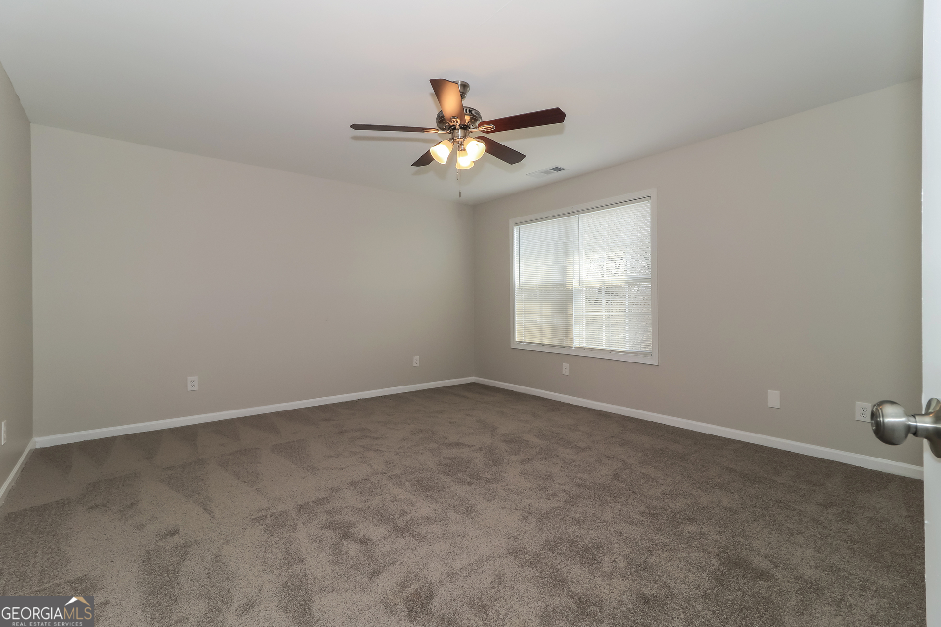2 Wingfoot Trail Cartersville, GA 30120 - Photo 9 of 18 an empty room with windows and fan
