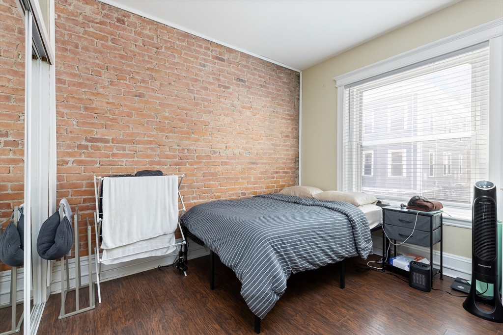 21 Royal Street, Unit 1 Boston, MA 02134 - Photo 14 of 17 a bedroom with a bed chair and window