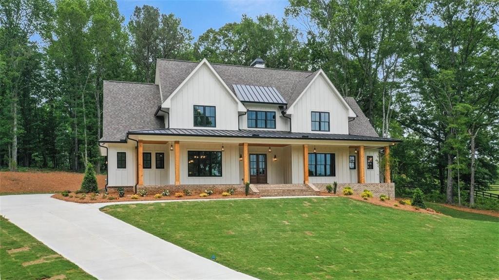 4008 Union Hill Road Canton, GA 30115 - Photo 1 of 1 a front view of a house with a yard