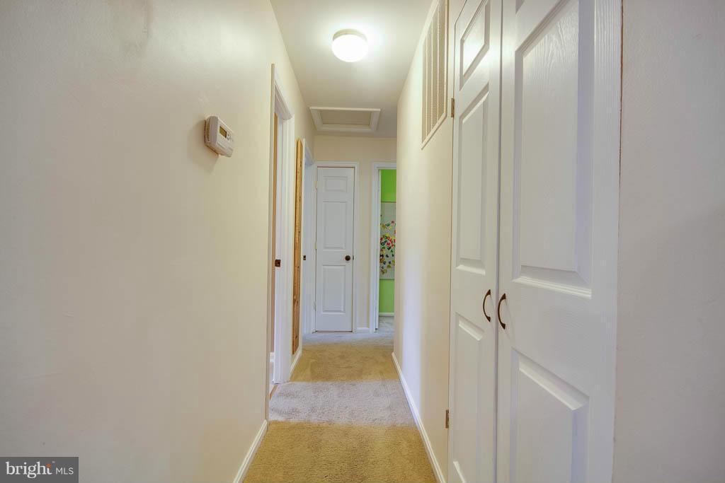 121 Plum Point Road Huntingtown, MD 20639 - Photo 10 of 30 a view of a bathroom from a hallway