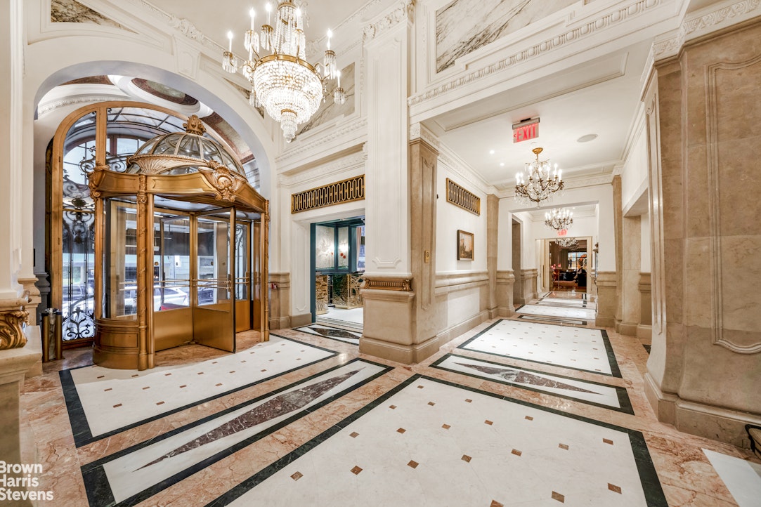2 East 55th Street, Unit 835/31 Manhattan, NY 10022 - Photo 4 of 14 a lobby with furniture and a chandelier