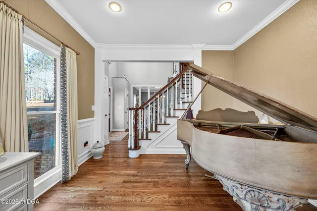 a spacious bedroom with a bed and a dresser