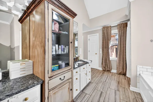 a bathroom with a bathtub and a shower