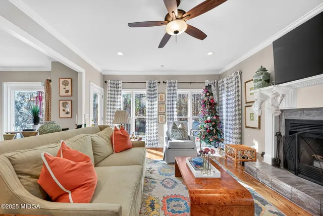 a living room with furniture and a fireplace