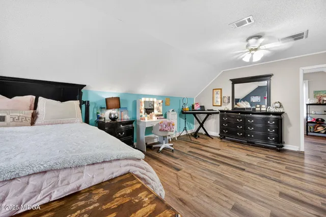 a bathroom with a sink toilet a mirror and a tub