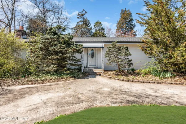 a view of a house with a yard and garage