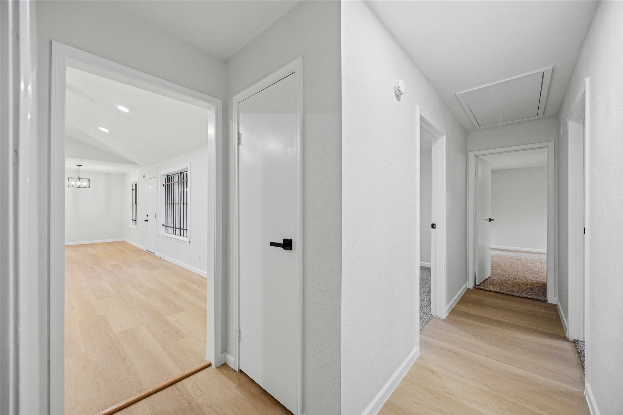 12703 Redfern Drive Houston, TX 77048 - Photo 18 of 28 Well-designed hallway connecting living and bedroom areas—featuring a clean, cohesive layout that enhances flow and functionality throughout the home.
