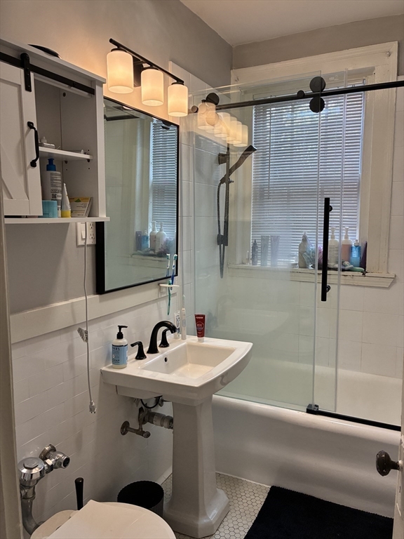 32 Shepard Street, Unit 24 Cambridge, MA 02138 - Photo 8 of 15 a bathroom with a sink and mirror