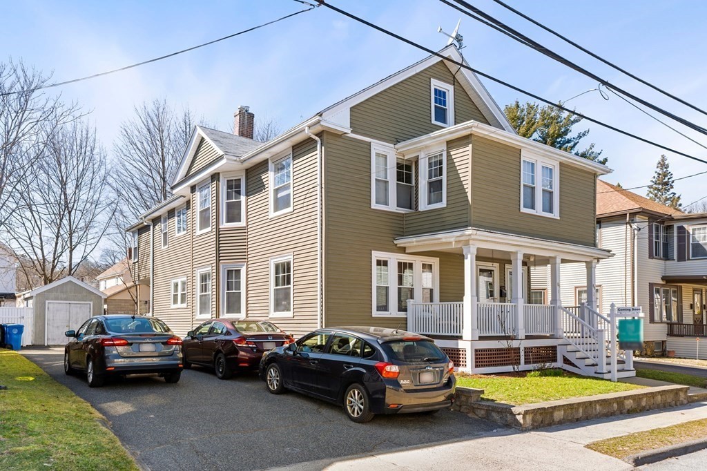 86 Howard Street, Unit 1 Waltham, MA 02451 - Photo 1 of 40 a car parked in front of a white building