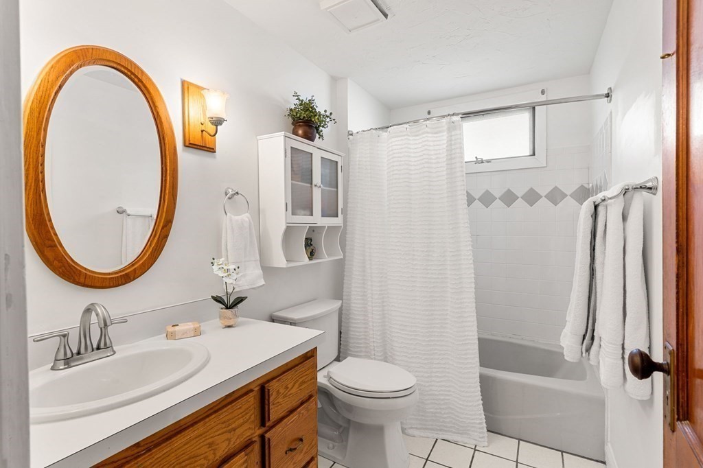 86 Howard Street, Unit 1 Waltham, MA 02451 - Photo 25 of 40 a bathroom with a sink toilet and shower