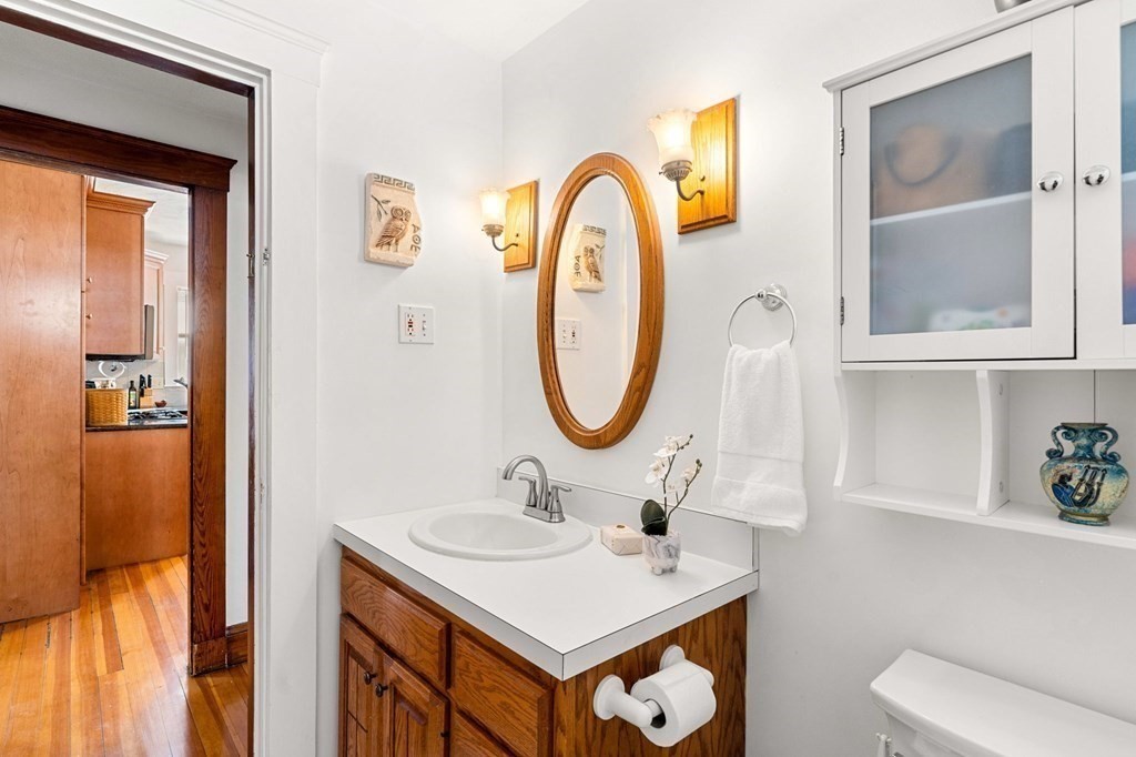 86 Howard Street, Unit 1 Waltham, MA 02451 - Photo 26 of 40 a bathroom with a sink and a mirror