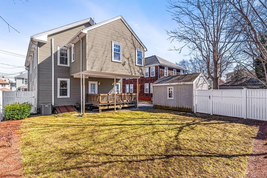 86 Howard Street, Unit 1 Waltham, MA 02451 - Photo 3 of 40 a view of a house with a swimming pool