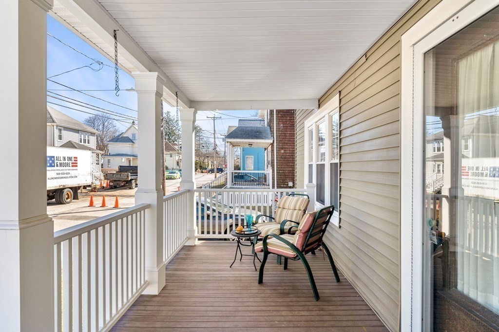 86 Howard Street, Unit 1 Waltham, MA 02451 - Photo 35 of 40 a view of a balcony with furniture