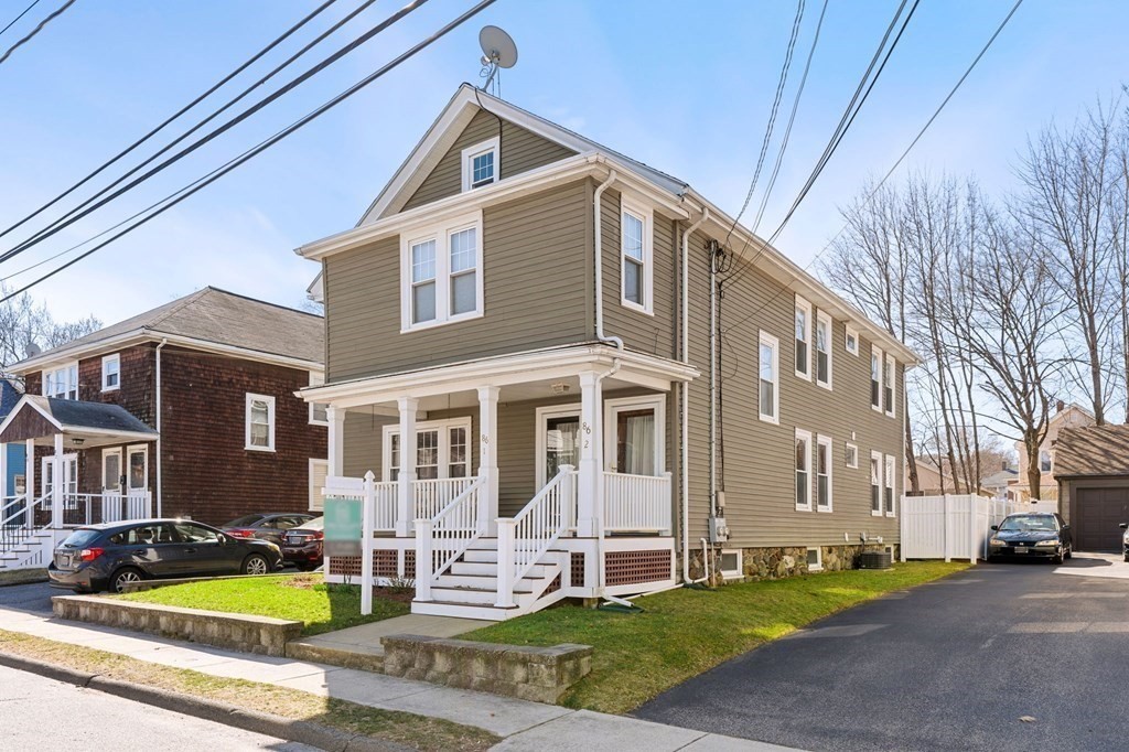 86 Howard Street, Unit 1 Waltham, MA 02451 - Photo 36 of 40 a view of house with yard in front of it