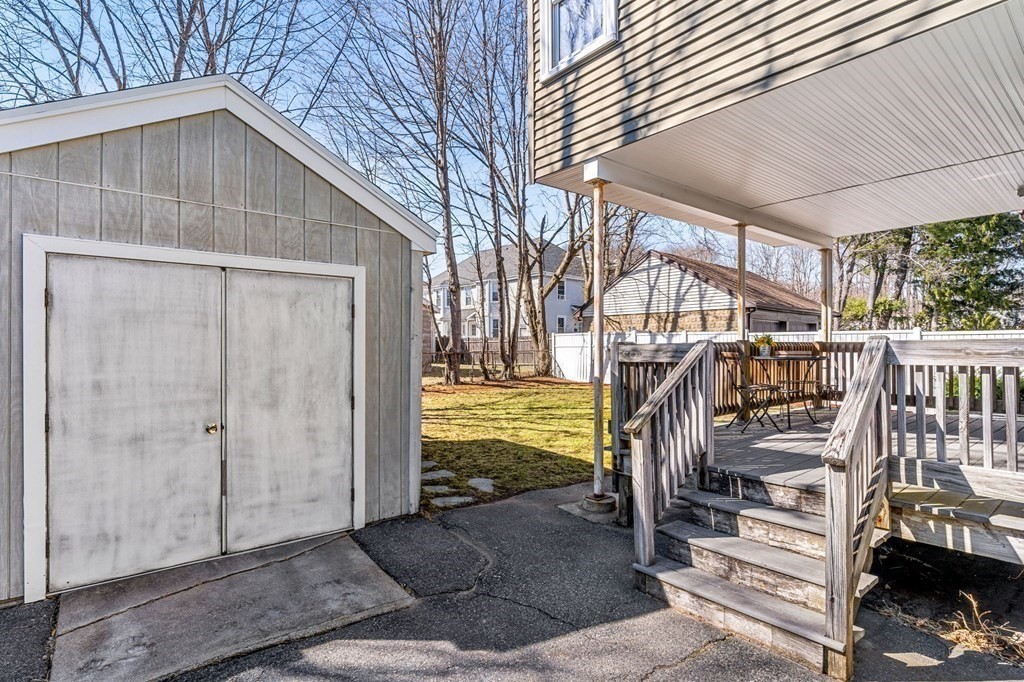 86 Howard Street, Unit 1 Waltham, MA 02451 - Photo 38 of 40 a view of a house with wooden deck