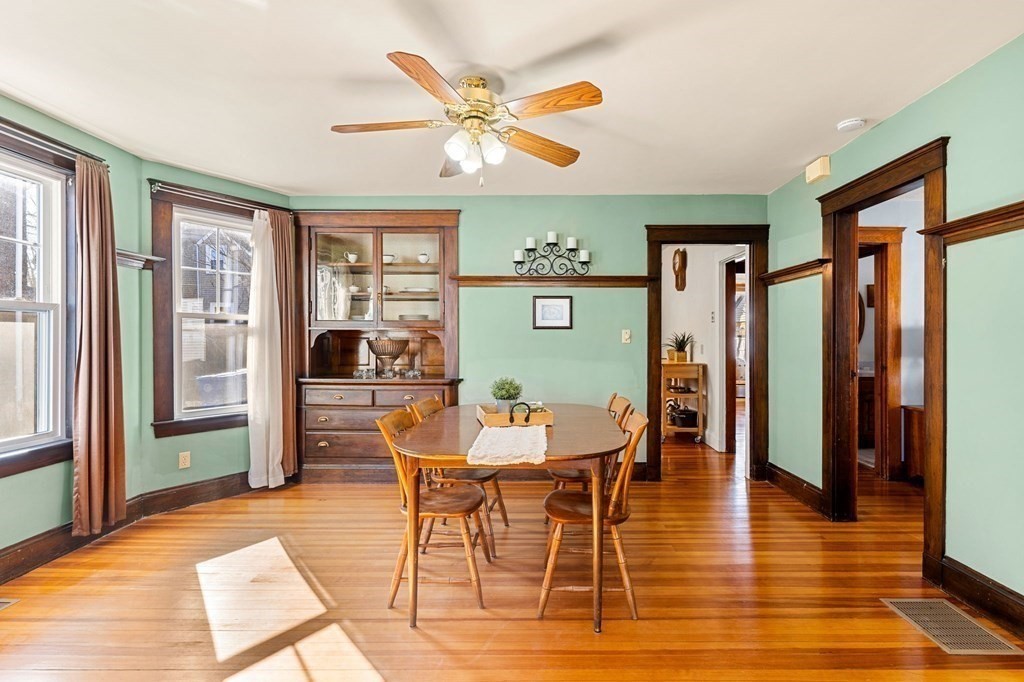86 Howard Street, Unit 1 Waltham, MA 02451 - Photo 6 of 40 a view of a dining room with furniture and wooden floor