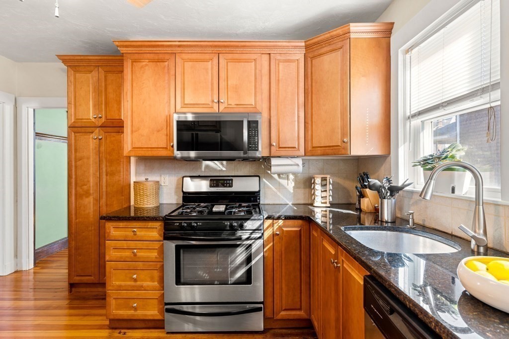 86 Howard Street, Unit 1 Waltham, MA 02451 - Photo 10 of 40 a kitchen with a window a sink and a counter