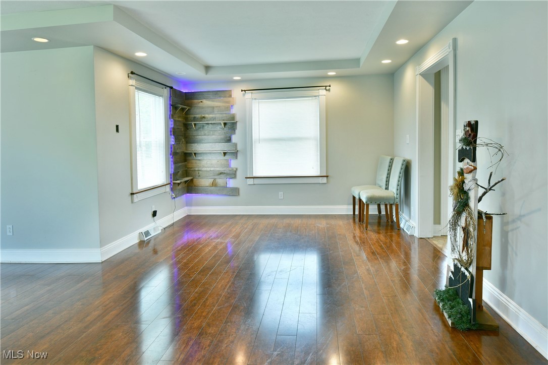 1735 Pleasant Valley Road Girard, OH 44420 - Photo 14 of 44 Spare room with wood-type flooring, recessed lighting, baseboards, and a tray ceiling