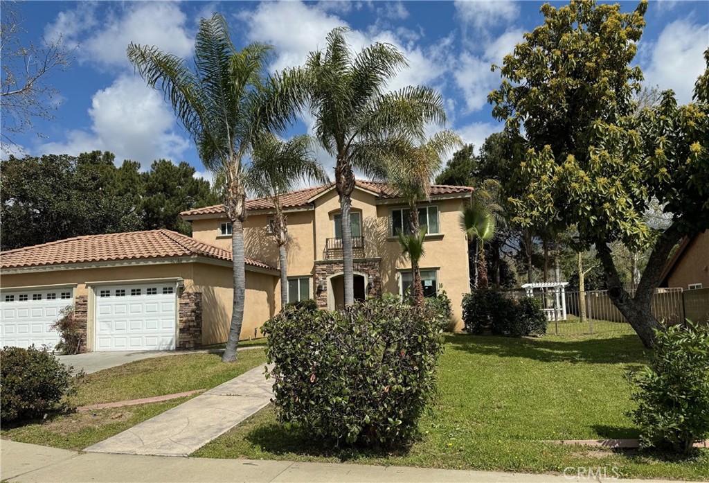 10130 Victoria Street Rancho Cucamonga, CA 91701 - Photo 1 of 1 front view of a house with a garden