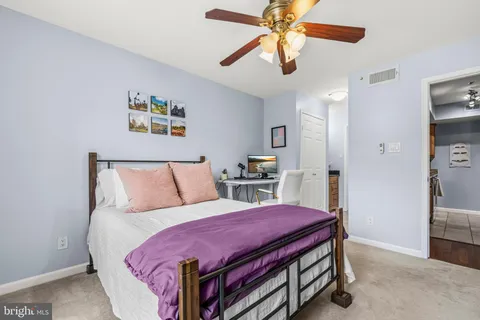 a bed room with a bed and a chandelier